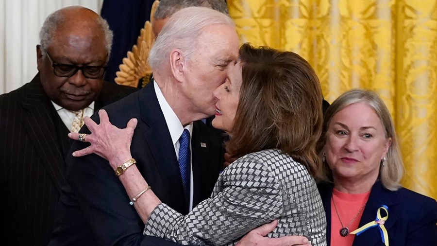 President Biden kisses House Speaker Nancy Pelosi (D-Calif.)