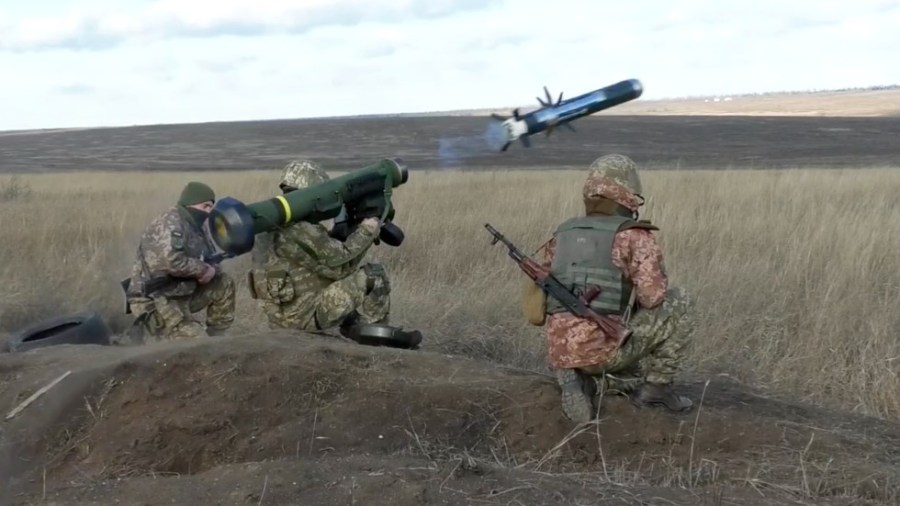 In this image taken from footage provided by the Ukrainian Defense Ministry Press Service, a Ukrainian soldiers use a launcher with US Javelin missiles during military exercises in Donetsk region, Ukraine