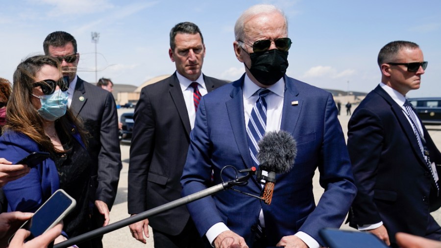 President Biden speaks to members of the media before boarding Air Force One at Andrews Air Force Base, Md.