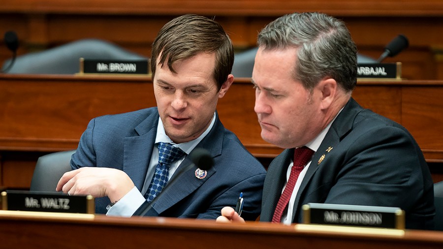 Rep. Jared Golden (D-Maine) speaks to Rep. Michael Waltz (R-Fla.) during a House Armed Services Committee hearing to discuss the President's FY 2023 budget for the Department of Defense on Tuesday, April 5, 2022.