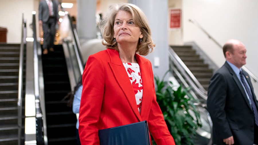 Sen. Lisa Murkowski (R-Alaska) returns to her office following procedural votes for nominations on Tuesday, April 5, 2022.