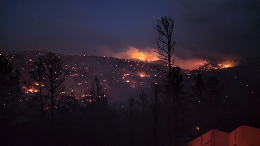 Fire burns along a hillside in the Village of Ruidoso, N.M.