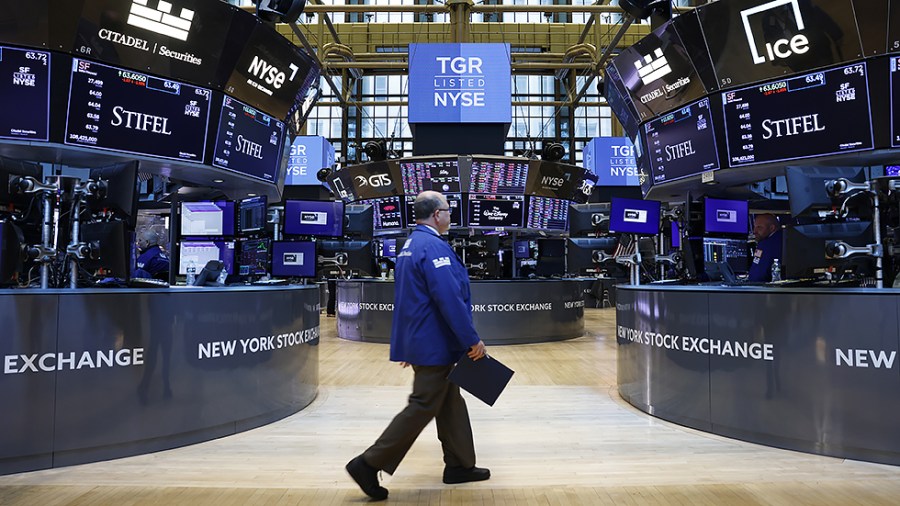 Traders work on the floor of the NYSE at the opening bell at the New York Stock Exchange on Wall Street in New York City on Monday, April 25, 2022.