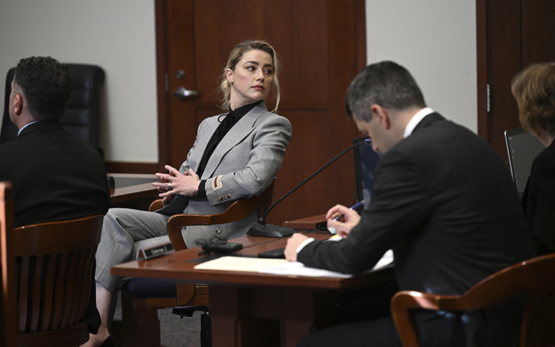 Actress Amber Heard looks on inside the courtroom