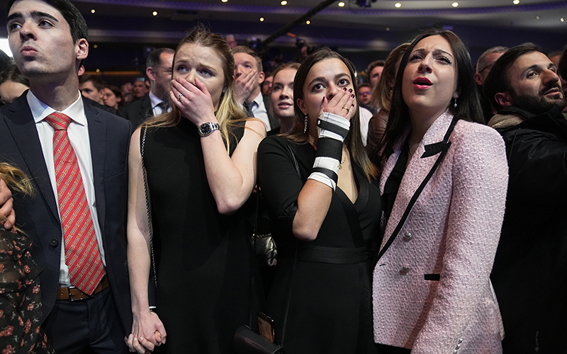 Supporters of French far-right candidate Eric Zemmour react in shock