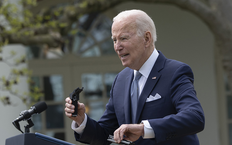 President Biden holds a “ghost gun” at the podium