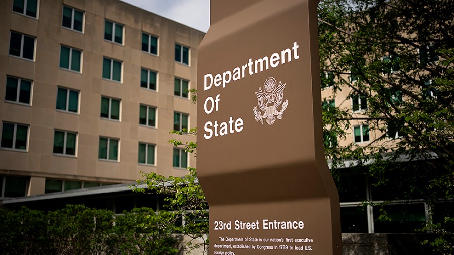 A sign near an entrance to the State Department is seen in Washington, D.C., on Friday, April 22, 2022