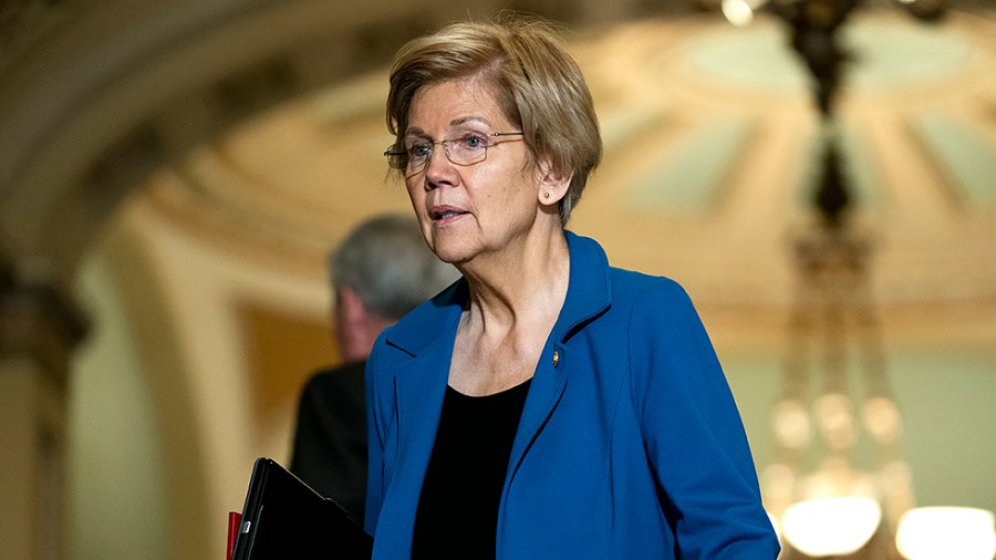 Sen. Elizabeth Warren (D-Mass.) leaves the weekly Senate Democratic policy luncheon on Tuesday, March 22, 2022.