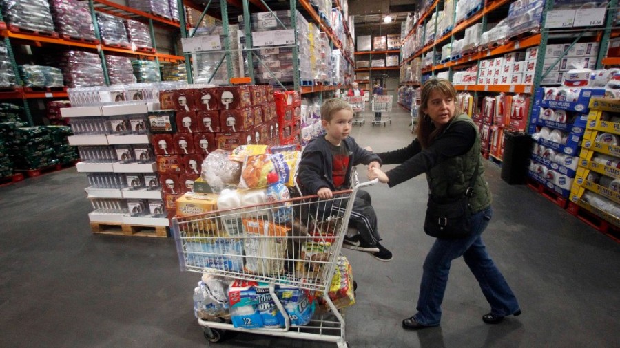 In this Dec. 7, 2011 photo, Tina VanPelt and her son Soloman, 4, shop at a Costco store, in, Portland, Ore.