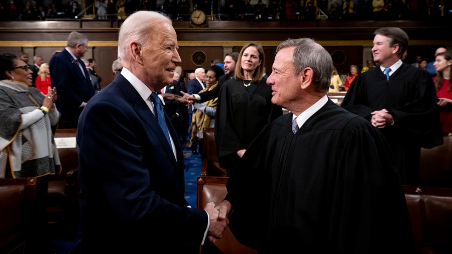 President Biden shakes hands with Supreme Court Chief Justice John Roberts prior to the State of the Union.