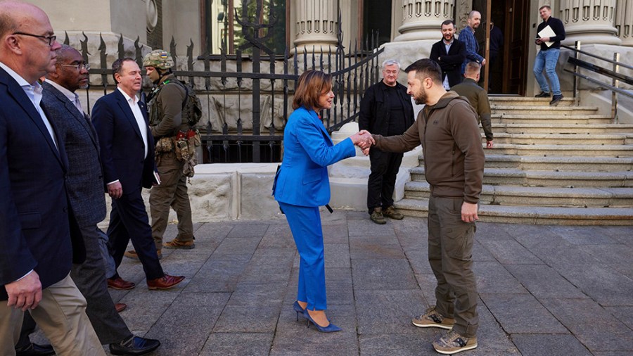 Nancy Pelosi and Volodymyr Zelensky shake hands