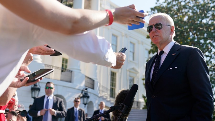 President Joe Biden speaks to reporters as he returns to the White House from Delaware on the South Lawn in Washington