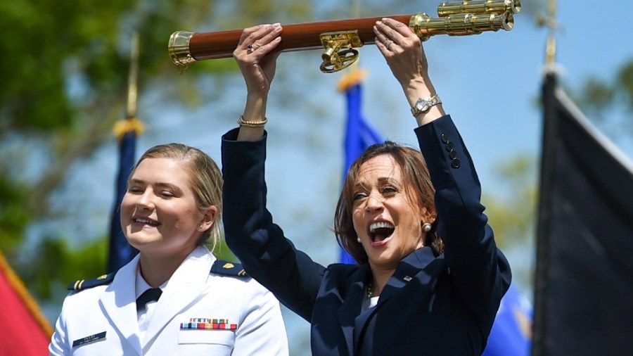 Vice President Kamala Harris lifts the school scepter at the conclusion of the U.S. Coast Guard Academy's 141st Commencement Exercises