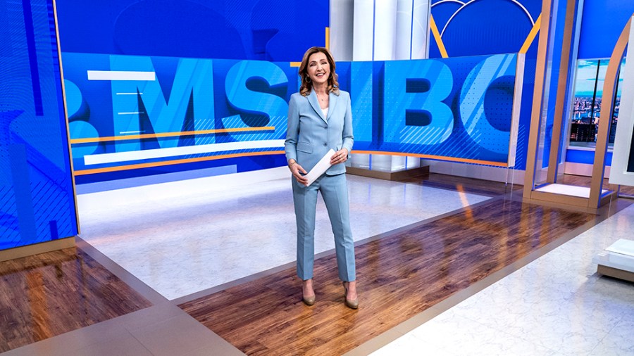 Chris Jansing stands in the MSNBC newsroom