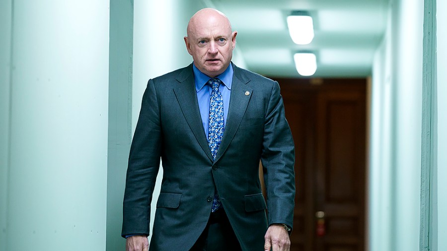 Sen. Mark Kelly (D-Ariz.) arrives for the weekly Senate Democratic policy luncheon on Tuesday, May 10, 2022.