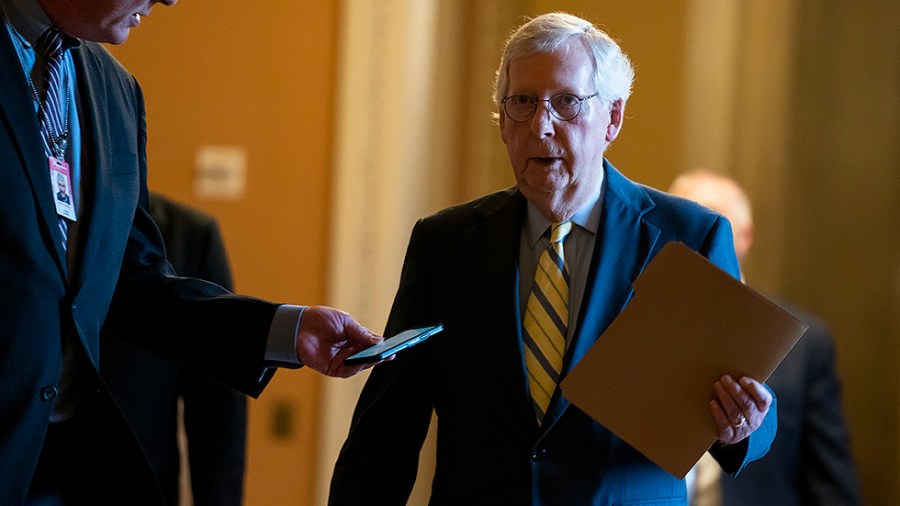 Minority Leader Mitch McConnell (R-Ky.) heads to the Senate Chamber to give a morning speech on Tuesday, May 3, 2022.