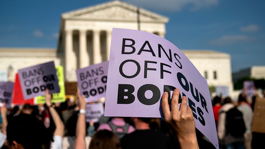 Protesters are seen outside the Supreme Court on Tuesday, May 3, 2022 after the leak of a draft majority opinion written by Justice Samuel Alito preparing for the court to overturn Roe v. Wade later this year.