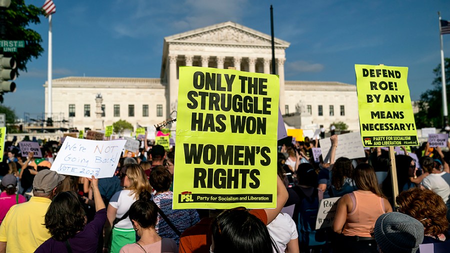 Protesters are seen outside the Supreme Court on Tuesday, May 3, 2022 after the leak of a draft majority opinion written by Justice Samuel Alito preparing for the court to overturn Roe v. Wade later this year.