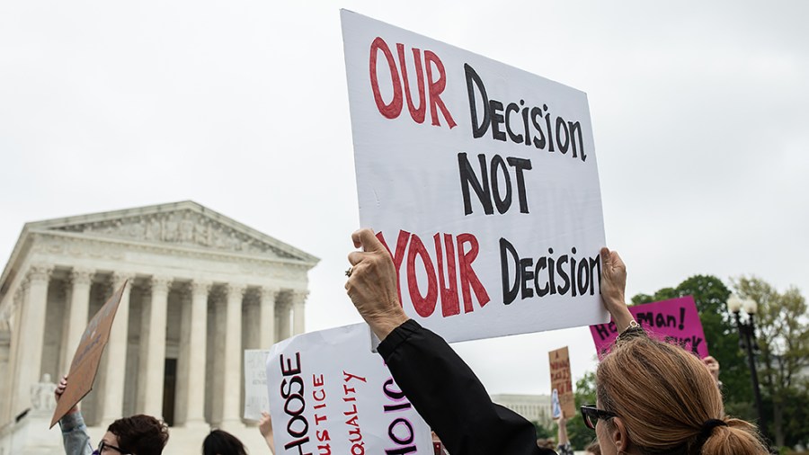 Abortion-rights and anti-abortion protestors gather in front of the U.S. Supreme Court after the leak of a draft majority opinion written by Justice Samuel Alito preparing for the court to overturn Roe v. Wade later this year, in Washington, D.C., on Wednesday, May 4, 2022.