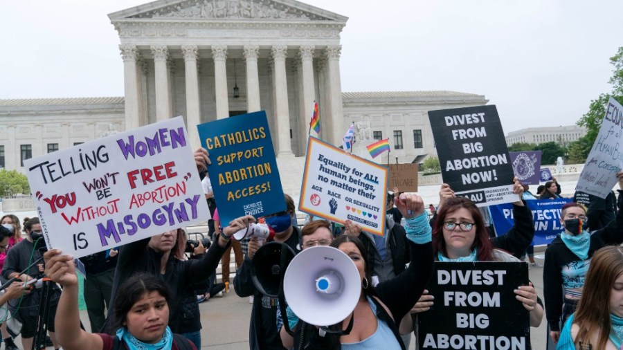 Demonstrators protest outside of the U.S. Supreme Court