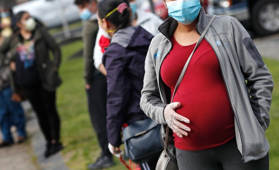 pregnant woman in mask