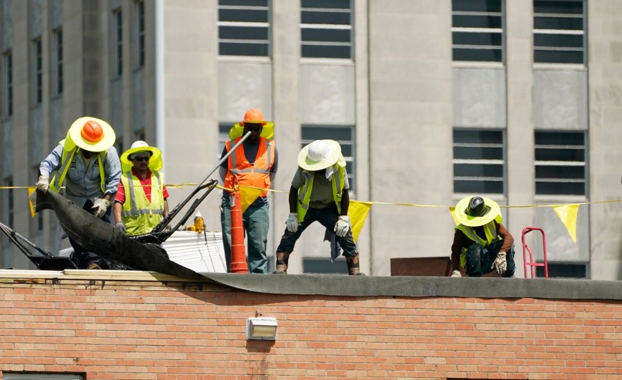 Workers on a roof.