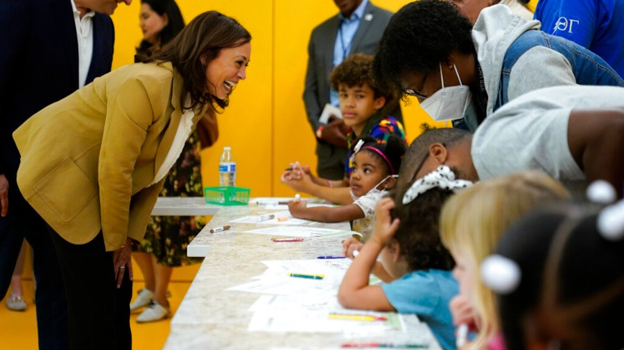 Kamala Harris speaks to young children