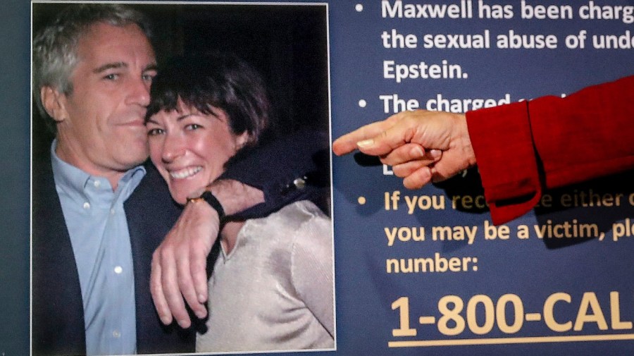 In this July 2, 2020, file photo, Audrey Strauss, acting U.S. attorney for the Southern District of New York, points to a photo of millionaire Jeffrey Epstein and British socialite Ghislaine Maxwell