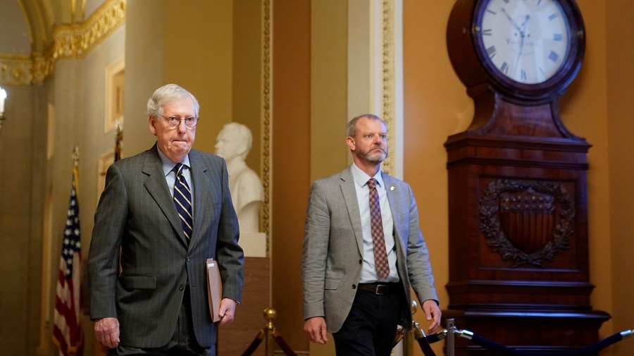 Senate Minority Leader Mitch McConnell (R-Ky.) walks to the Senate Chamber