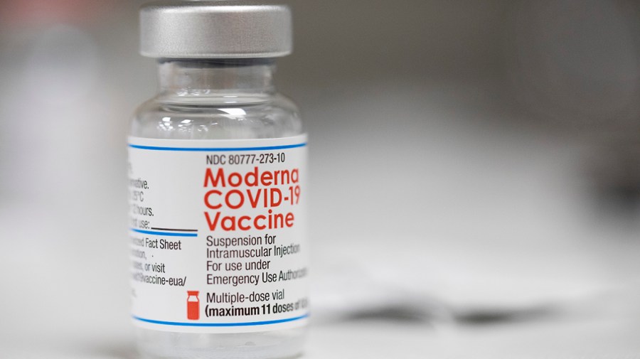 A vial of the Moderna COVID-19 vaccine is displayed