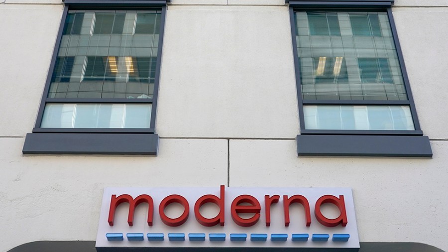 A sign for Moderna, Inc. hangs on its headquarters