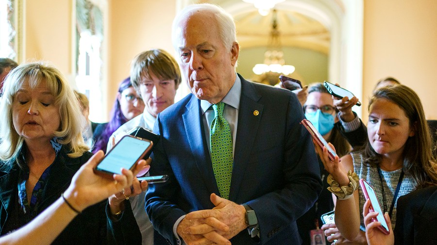 Sen. John Cornyn (R-Texas) speaks to reporters after speaking on the Senate floor to give an update on bipartisan negations and legislative writing on a gun reform package on Tuesday, June 21, 2022.