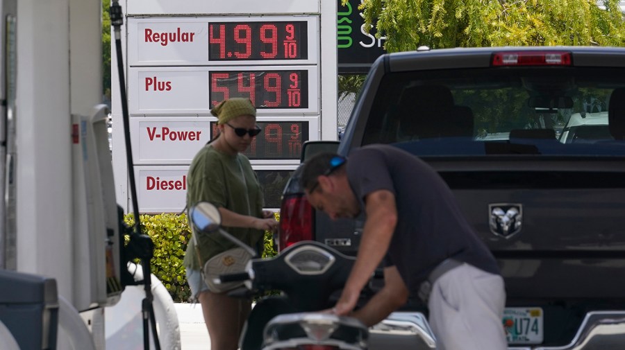 Customers fill up at a Shell gas station