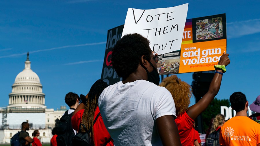 People for gun reform hold signs as they attend a rally held by multiple groups outside the U.S. Capitol in Washington, D.C., on Monday, June 6, 2022.