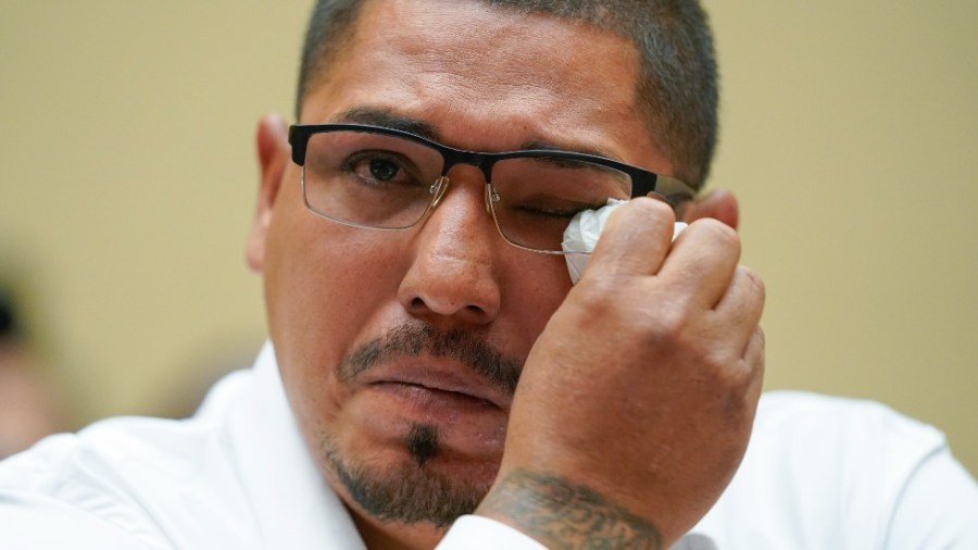 MiguelCerrillo, father of Miah Cerrillo a fourth grade student at Robb Elementary School in Uvalde, Texas, wipes his eye as he testifies during a House Committee on Oversight and Reform hearing on gun violence