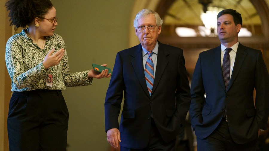 Minority Leader Mitch McConnell (R-Ky.) returns to his office after speaking on the Senate Floor on Tuesday, June 14, 2022.