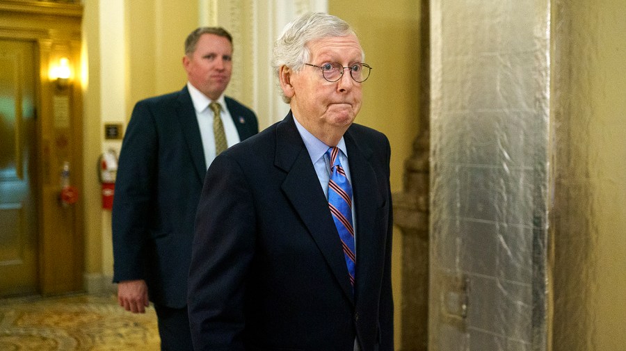 Minority Leader Mitch McConnell (R-Ky.) heads to the weekly Senate Republican policy luncheon on Tuesday, June 14, 2022.