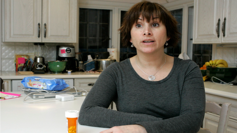 Rena Cerbone, 41, talks about medication on the counter that she took to prevent migraines.