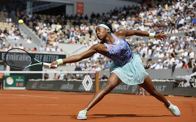 Coco Gauff of the U.S. returns the tennis ball to Sloane Stephens of