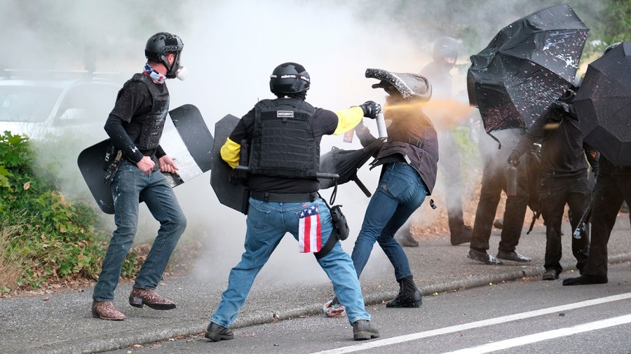 Members of the far-right group Proud Boys and anti-fascist protesters clash