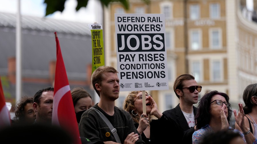 People attend a union train strike rally in the United Kingdom