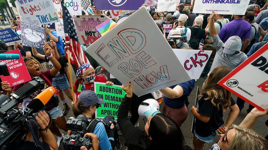 Protesters for and against abortion rights demonstrate outside the Supreme Court on Friday, June 24, 2022 in anticipation of an opinion that could strike Roe v. Wade.