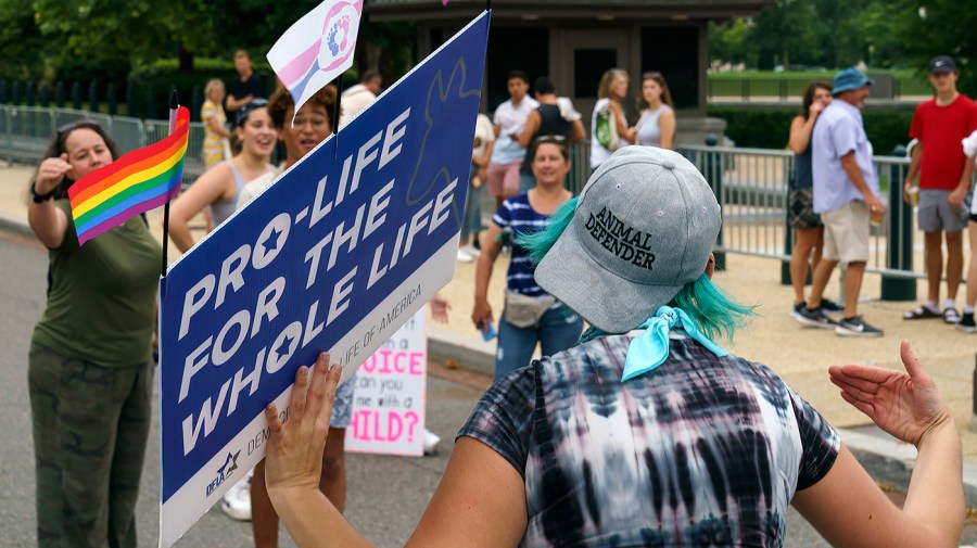 Protesters for and against abortion rights argue outside the Supreme Court on Monday, June 27, 2022.