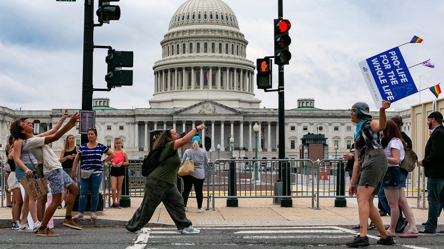 Protesters for and against abortion demonstrate between the Capitol and Supreme Court on Monday, June 27, 2022 in the aftermath of its decision to overturn Roe v. Wade.