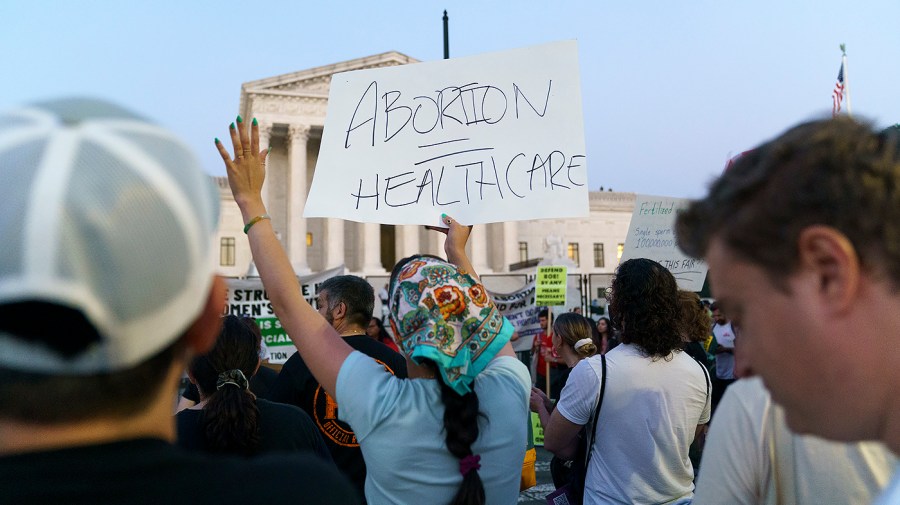 Protesters for abortion rights demonstrate outside the Supreme Court on Friday, June 24, 2022 after the court released a decision to strike Roe v. Wade.