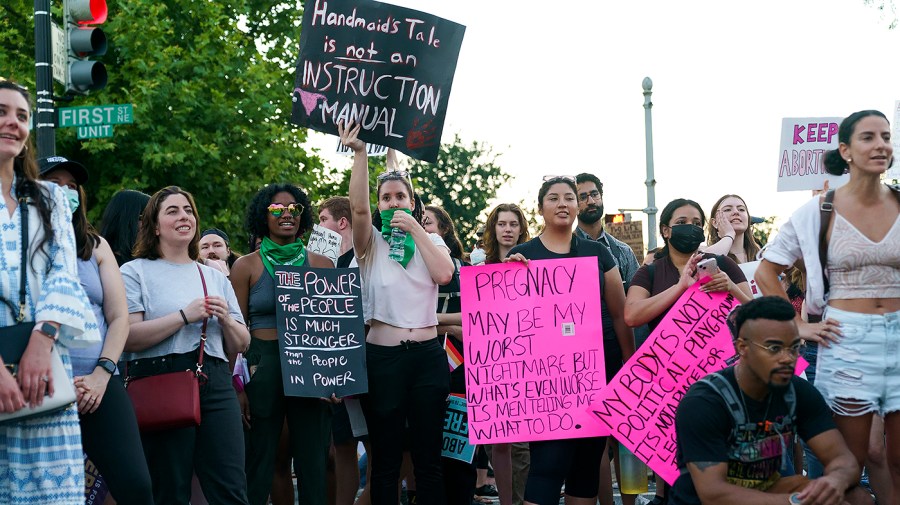 Protesters for abortion rights demonstrate outside the Supreme Court on Friday, June 24, 2022 after the court released a decision to strike Roe v. Wade.