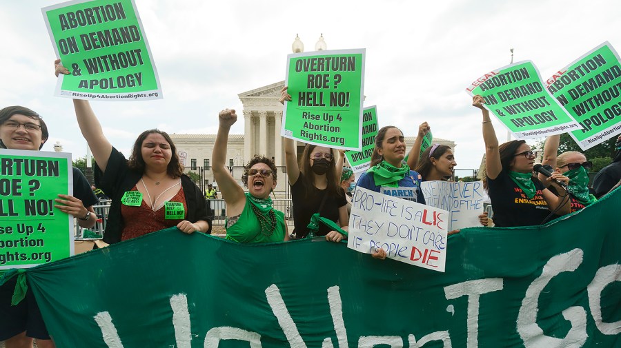 Protesters for abortion rights demonstrate outside the Supreme Court on Friday, June 24, 2022 in anticipation of an opinion that could strike Roe v. Wade.