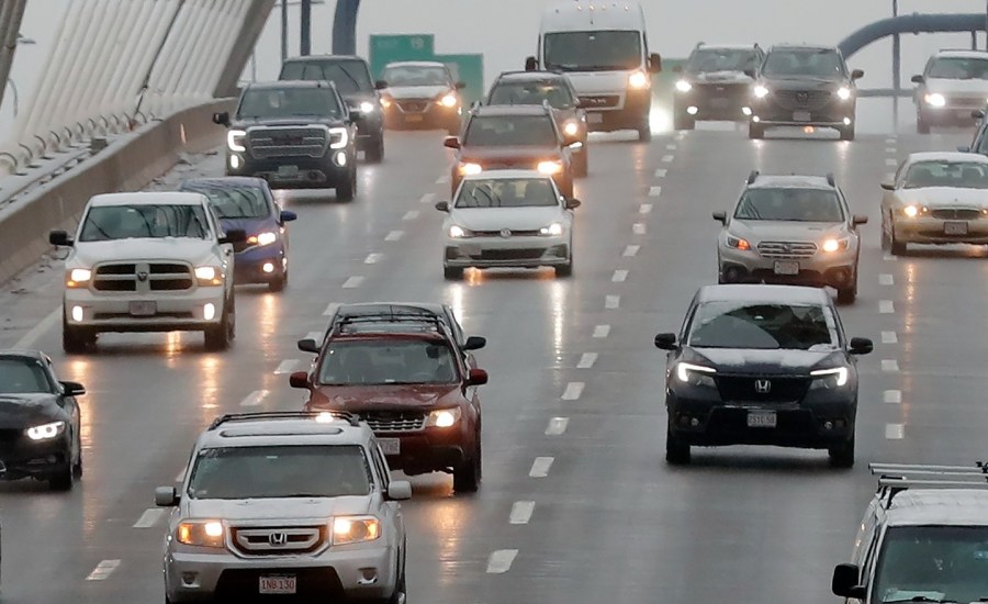 Cars drive over a bridge in Boston, Massachusetts