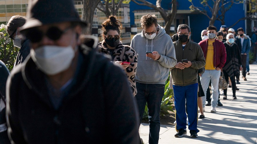 People wait in line for a COVID-19 test in Los Angeles