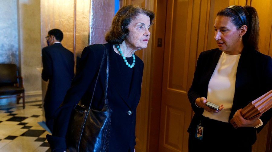 Sen. Dianne Feinstein (D-Calif.) speaks to an aide following a procedural vote regarding the nomination of Julianna Michelle Childs to be United States Circuit Judge for Washington, D.C., on Thursday, July 14, 2022.